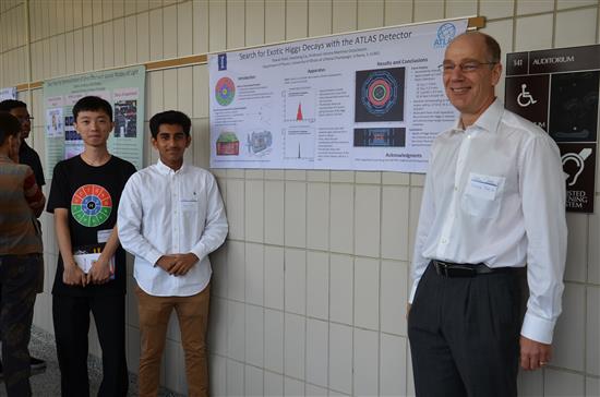 Physics Professor and Young Scholars Program Co-Director Doug Beck poses with Young Scholar Shavon Patel and his mentor Huacheng Cai at the poster symposium at Loomis Lab on July 28, 2017. Patel worked on particle physics in Asst. Professor Verena Martinez Outschoorn's research group.