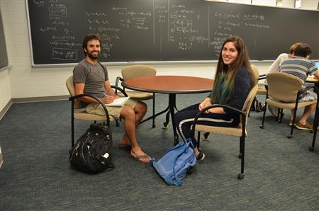 Mentor Will Wheeler meets with Young Scholar Luciana Toledo-Lopez at the Institute for Condensed Matter Theory. Toledo-Lopez worked on topological solid simulation, learning computer coding.