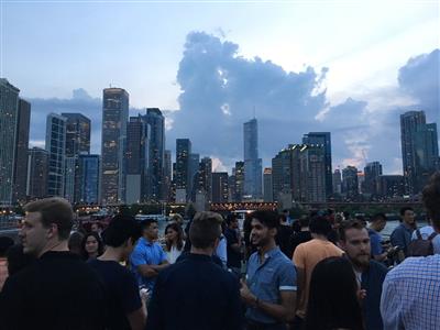 Think Chicago: Lollapalooza participants networking with each other on a boat tour along the Chicago River.