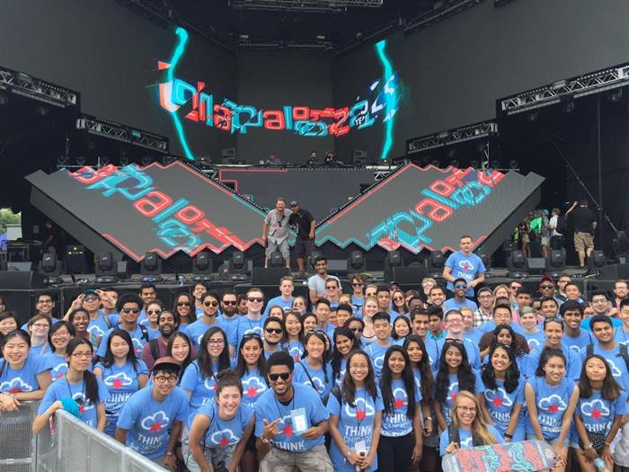 Think Chicago Lollapalooza participants pose for a group picture after a behind the scenes tour of one of the main stages.