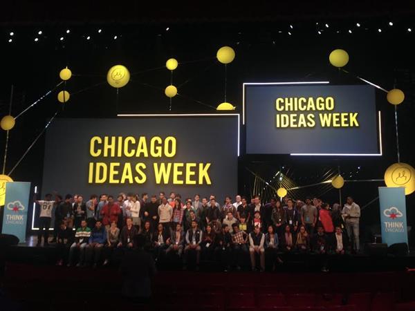   Students gather on Chicago Ideas Week stage for a group photo.