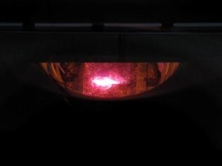 Photo of the electron beam as it strikes the liquid metal target.