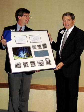 NPRE Department Head James F. Stubbins, left, presents Prof. Barclay G. Jones with a gift commemorating his work with the now-decommissioned TRIGA reactor.