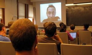 Virtual lab developer Imran Haddish speaks to the students in a live video chat.