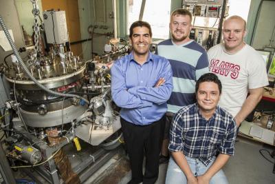 Associate Prof. Jean Paul Allain with his NPRE students, Zak Koyn, Anton Neff, and Carlos Bedoya (seated). Photo by L. Brian Stauffer