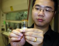 NPRE graduate student Ke Yang works with an ionic glass specimen.