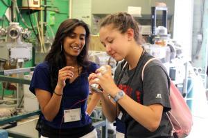 WYSE campers wind coil around a soda can.