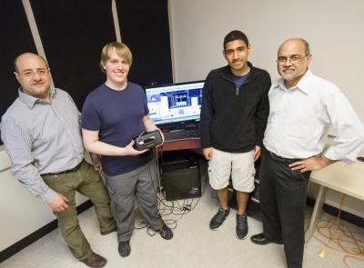 Prof. Rizwan Uddin, right, and his group in the Virtual Education and Reseach Laboratory (VERL): from left, Visiting Scholar Calogero Sollima; undergraduates Cory Scribner and Justin Joseph. Photo by L. Brian Stauffer.