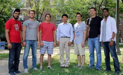 Associate Prof. Ling-Jian Meng, middle, and his students.