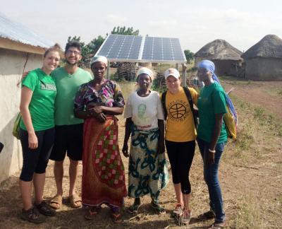 Cassandra Arenz, left, with the villagers in Ghana.