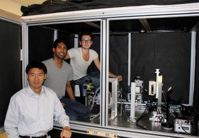 Associate Prof. Ling-Jian Meng, foreground, with his graduate students Jonathan George and Luca Giannoni, with the FXIL facility.