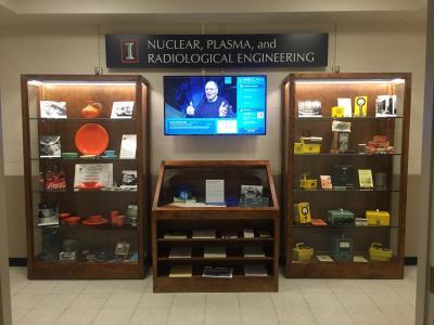 This display of nuclear artifacts on the west entrance to Talbot Laboratory's second floor features momentos and a video of the TRIGA reactor.