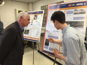 2016 NPRE Distinguished Alumni Award winner Stephen Coggeshall viewed student posters during events held in April in NPRE.