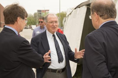 George Miley, center, chats with NPRE Department Head Jim Stubbins, left, and Eugene Grecheck, president of the American Nuclear Society, right, during the dedication of the former TRIGA reactor as an ANS National Nuclear Historic Landmark. Miley, who did much of his research on the former facility, which had been located on the Engineering campus' east side, had nominated TRIGA for the honor.