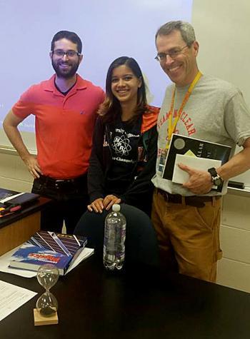 Alyssa Hayes with Warren Township High School physics teachers Louie Klein (left) and Pieter Kreunan (right).