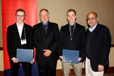 From left, 2018 Taber Scholar Connor Daly, NPRE alumnus Brad Radl, 2018 Taber Scholar Joe Darga, and NPRE Department Head Rizwan Uddin