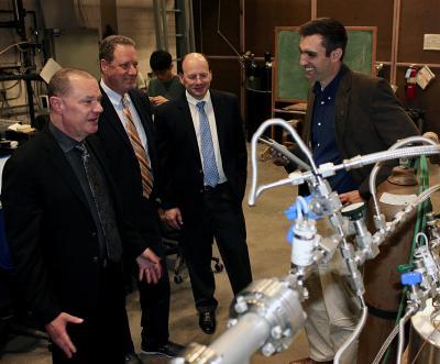 From left, Scot Greenlee, Ed McVey and Ken Peterson tour Assistant Prof. Caleb Brooks' Multiphase Thermo-fluid Dynamics Laboratory