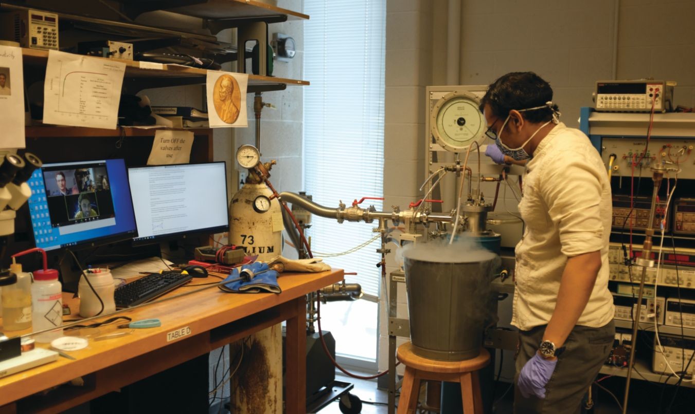 Physics graduate student Shubhang Goswami measures superconductivity in thin films. The experiment is part of a senior-level lab course at the University of Illinois at Urbana-Champaign. Undergraduates participate remotely and can partially control the measurements. Photo by Brian DeMarco