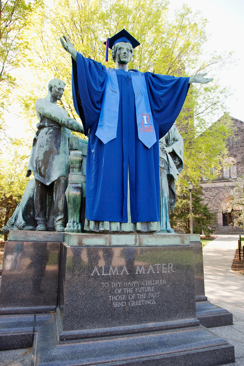 Photo of Alma Mater with graduate gown on