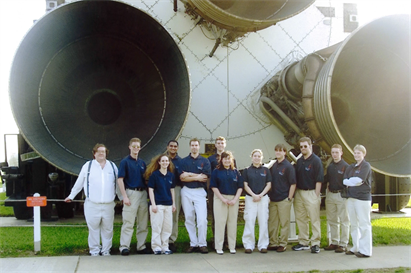 Members of the Float'n Illini in front of a space shuttle at the Lyndon B. Johnson Space Center
