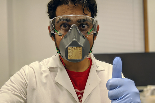 Graduate student Bijal Patel displays the group&#8217;s first &#8220;Montana Mask&#8221; (and safety PPE for mask assembly) in the group&#8217;s lab at Davenport Hall. (Image courtesy of Diao Research Group.)