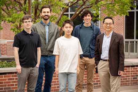 Human Zhao research group. Front row: Dr. Stephan Lane (iBioFAB manager), Guanhua (Daniel) Xun (graduate student), and Prof. Human Zhao, Steven L. Miller Chair of chemical and biomolecular engineering, and professor of chemistry, biochemistry, biophysics, and bioengineering. Back row: Vassily Petrov (ECE undergraduate student, currently software engineer in Zhao lab), Brandon Pepa (mechanical engineering undergraduate student who recently graduated).